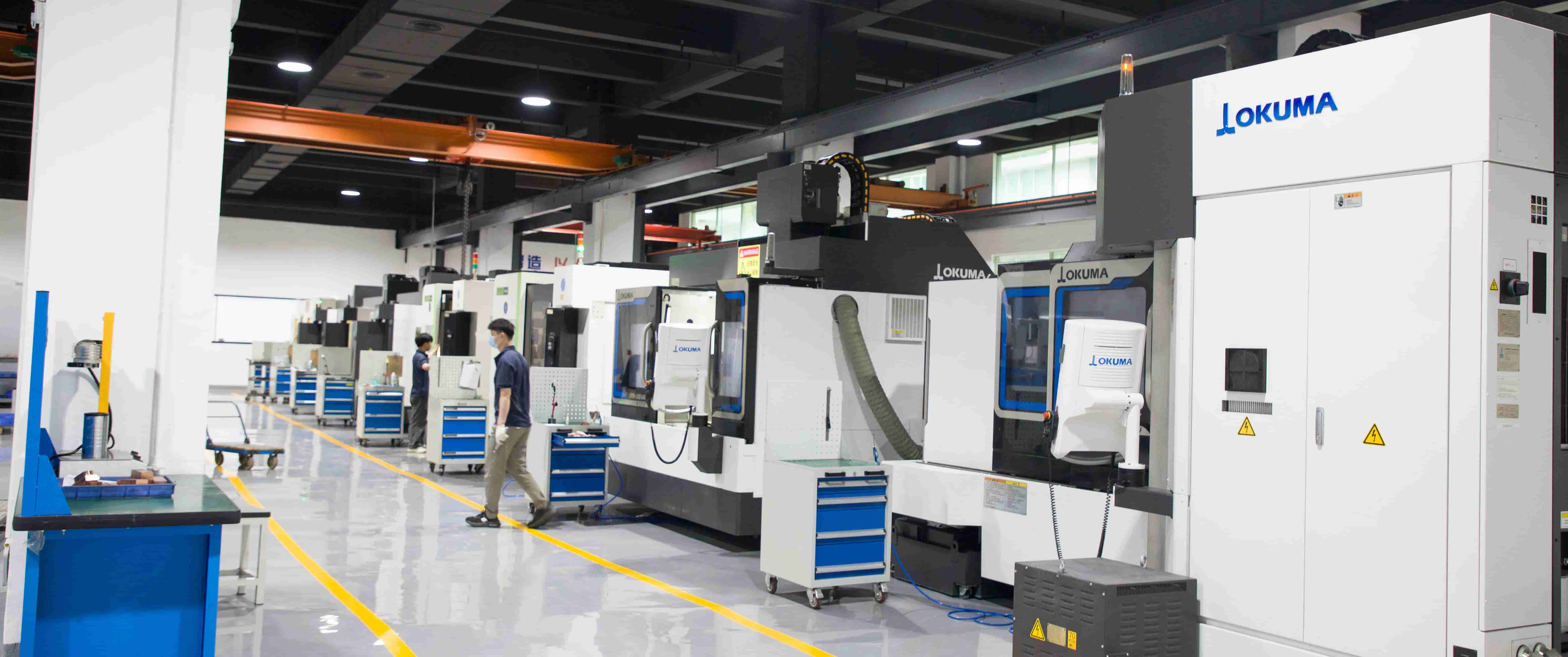 Mastars employees discussing sustainable practices in mold assembly